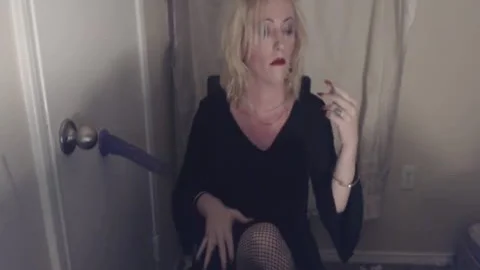 Goth tranny Smokes And Pleasures Herself.